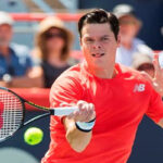 milos raonic returns volley on manday against lucas pouille in montreal at the rogers cup