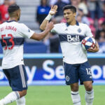 Ali Adnan of the Vancouver Whitecaps celebrates with teammate Fredy Montero after he scored a late minute goal on Saturday to end their match against the Columbus Crew