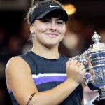 bianca andreescu poses for the media with her trophy after winning the u.s. open