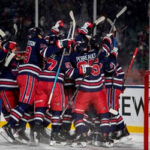 bryan little is mobbed by his teammates after scoring the winning overtime goal on saturday in regina.