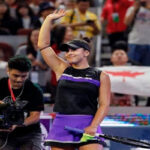 canada's bianca andreescu waves to the crowds after defeating american jennifer brady in the third round of the china open tennis tournament in beijing, on thursday.