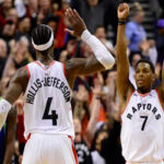 toronto's kyle lowry celebrates with rondae hollis-jefferson after the raptors staged an historic comeback to defeat the dallas mavericks