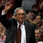 basketball hall of fame coach eddie sutton waves to the crowds as two former teams he coach faced off in fayetteville, arkansas at the bud walton arena.