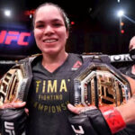 amanda nunes poses with her championship belts on saturday after defeating canadian felicia spencer during ufc 250.