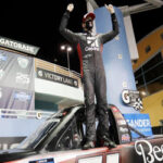 kyle busch stands tall as he celebrates winning the nascar truck series auto race in homestead, fla on saturday.