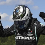 valtteri bottas raises his arms in celebration after winning the austrian grand prix in spielberg, austria