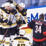 boston bruins charlie coyle,david krejci and patrice bergeron celebrate after scoring against the hurricanes in the second period last night during game 3 of the first round series