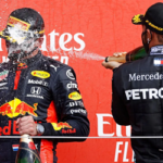 Lewis Hamilton sprays champagne over max Verstrappen after the red bull driver won the 70th Anniversary Grand Prix at Silverstone on Sunday