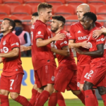 tfc's richie laryea is congratulated by teammates after scoring the winning goal on friday night against the vancouver whitecaps