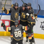 golden knights nate schmidt and nicolas roy congratulate shea thedore after he scored late in the third period last night in game 7 against the vancouver canucks.