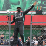 lewis hamilton waves to fans in portugal after winning the portugal gp and breaking michael schumacher's record of 91 wins.