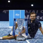 daniil medvedev poses with his trophy after defeating dominic thiem at the atp finals in london on sunday.