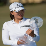 jin young ko poses with her trophy after winning the cme group tour championship on sunday in naples, florida.