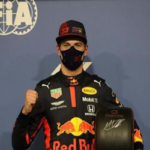 Max Verstappen poses for the media after winning pole position for Sunday's Abu Dhabi Grand Prix.