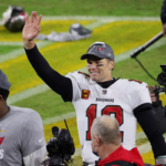 tom brady waves to fans after leading the tampa bay buccaneers to victory and earning his tenth trip to the super bowl on sunday at the raymond james stadium in tampa, florida.
