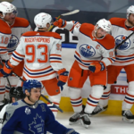 the edmonton oilers congratulate connor mcdavid after he scored the winning goal in overtime on saturday against the toronto maple leafs.